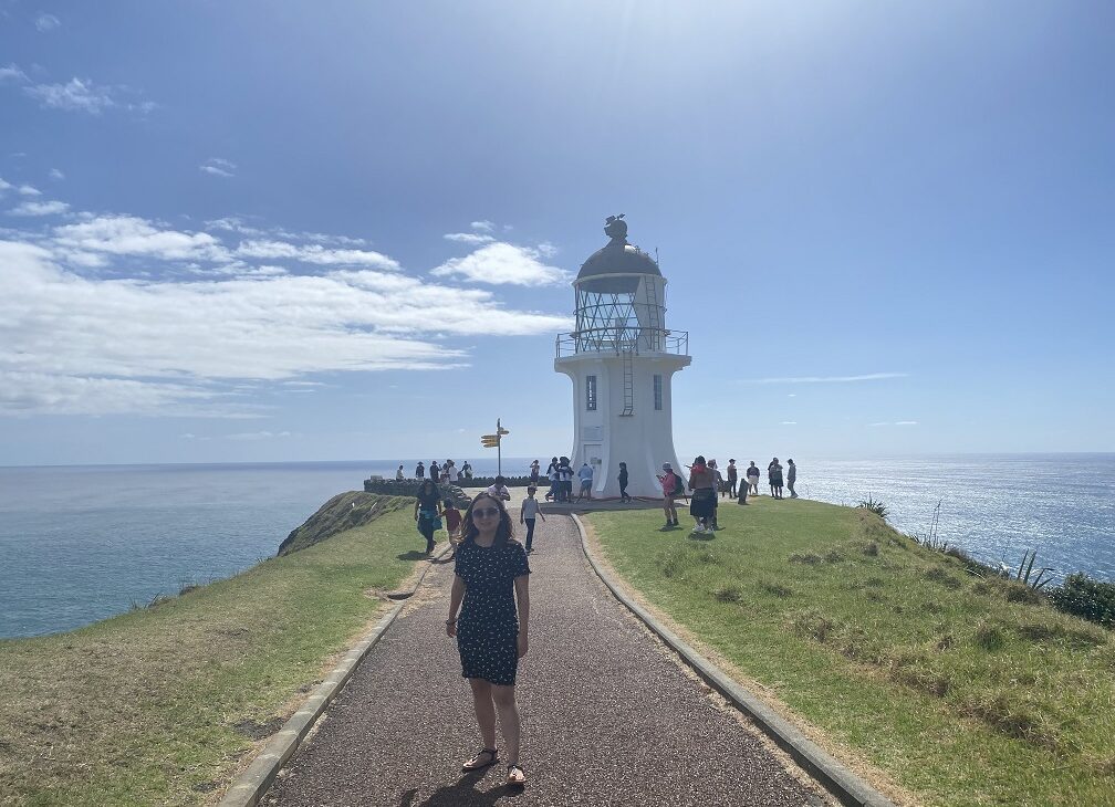 in front of the Cape Reinga Lighthouse, North Island, New Zealand